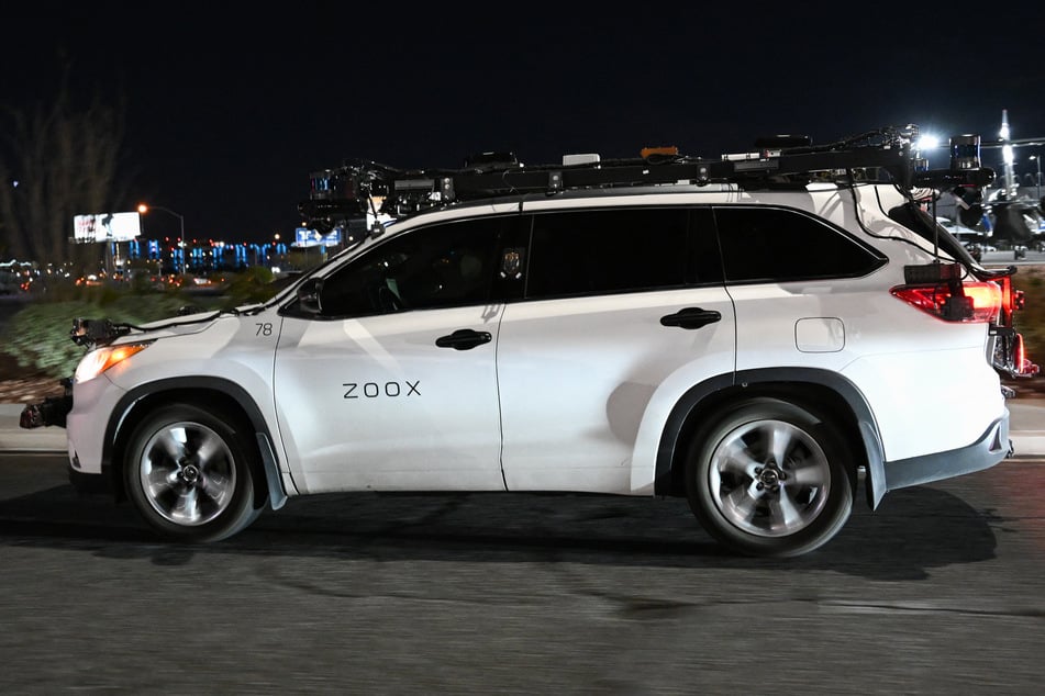 A Toyota sport-utility vehicle modified by Zoox, which combines radars, lidar, and cameras to test its software, drives on a road ahead of the 2023 Consumer Electronics Show in Las Vegas, Nevada.