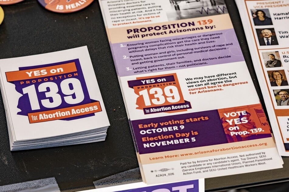 A table with literature calling for a YES vote on Proposition 139, the right to abortion initiative, is displayed at the entrance to the Murphy-Wilmot Library in Tucson, Arizona.