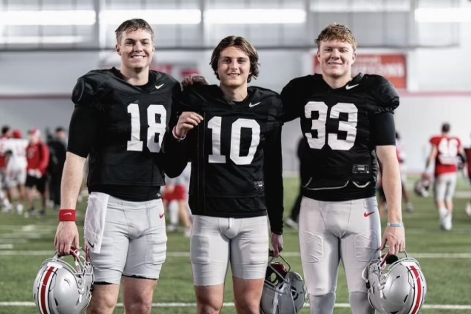 Freshman quarterback Julian Sayin (c.) has caught the attention of Ohio State head coach Ryan Day, who has now added him to the quarterback competition.