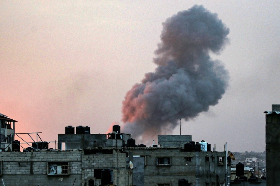 Smoke rises above buildings during an early morning Israeli strike on Rafah in the southern Gaza Strip on May 11, 2023.