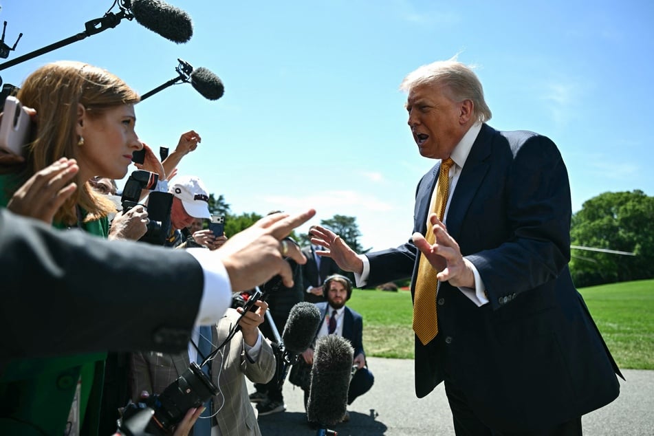 President Donald Trump speaks to the press before walking to board Marine One as he departs from the South Lawn of the White House in Washington, DC, on Tuesday.