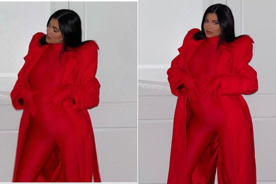 Kylie Jenner flaunted her growing bump on Thursday in an edgy, all-red one-piece jumpsuit by Richard Quinn.