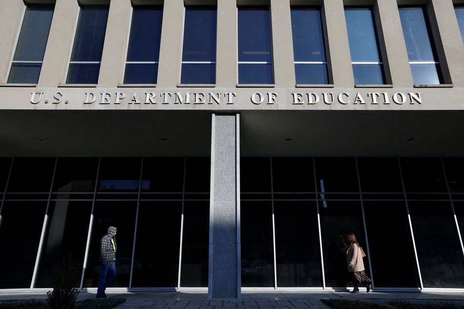 People walk in front of the US Department of Education building in Washington DC.