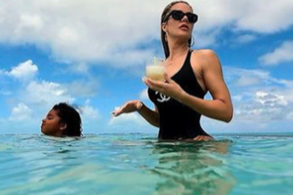 Khloé Kardashian enjoys some R&amp;R with her daughter, True, while vacationing in Turks and Caicos.