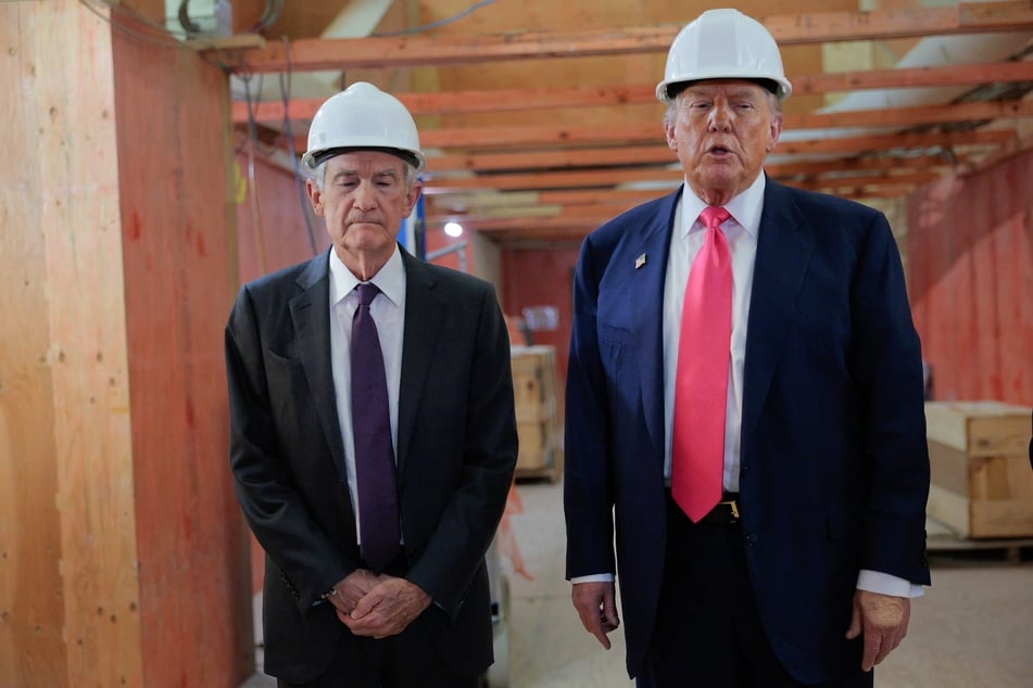 Donald Trump (R) arrived for a tour of the US Federal Reserve Thursday as the president escalates pressure on its chairman Jerome Powell (L) over the central bank's management of the economy.