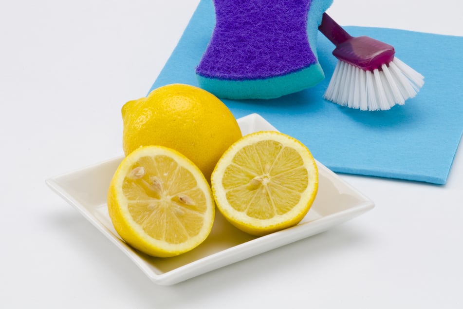 Use acids from lemon and vinegar to clean your stove top.