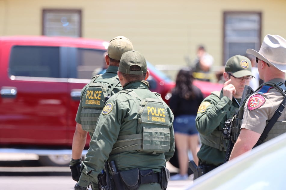 Law enforcement outside Robb Elementary School, where a gunman killed nineteen children and two adults in Uvalde, Texas.