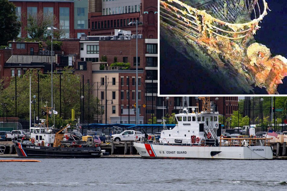 A US Coast Guard vessels sits in port in Boston Harbor across from the US Coast Guard Station. The rescue agency confirmed Monday it is searching for a submersible vessel used to take tourists to see the wreckage of the Titanic (inset) that has gone missing.