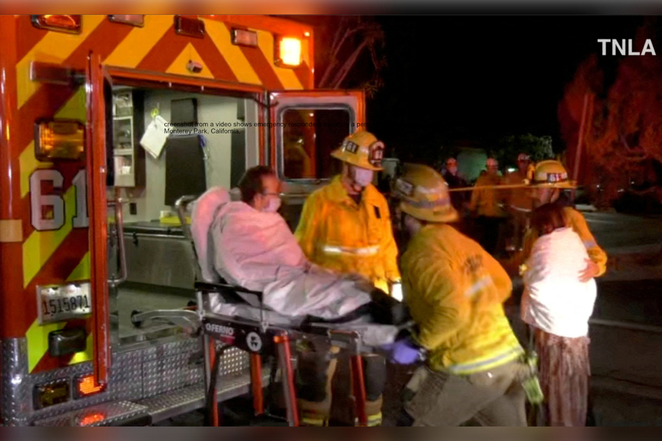 Emergency responders assisted a victim following a shooting at Monterey Park, California on Saturday night.
