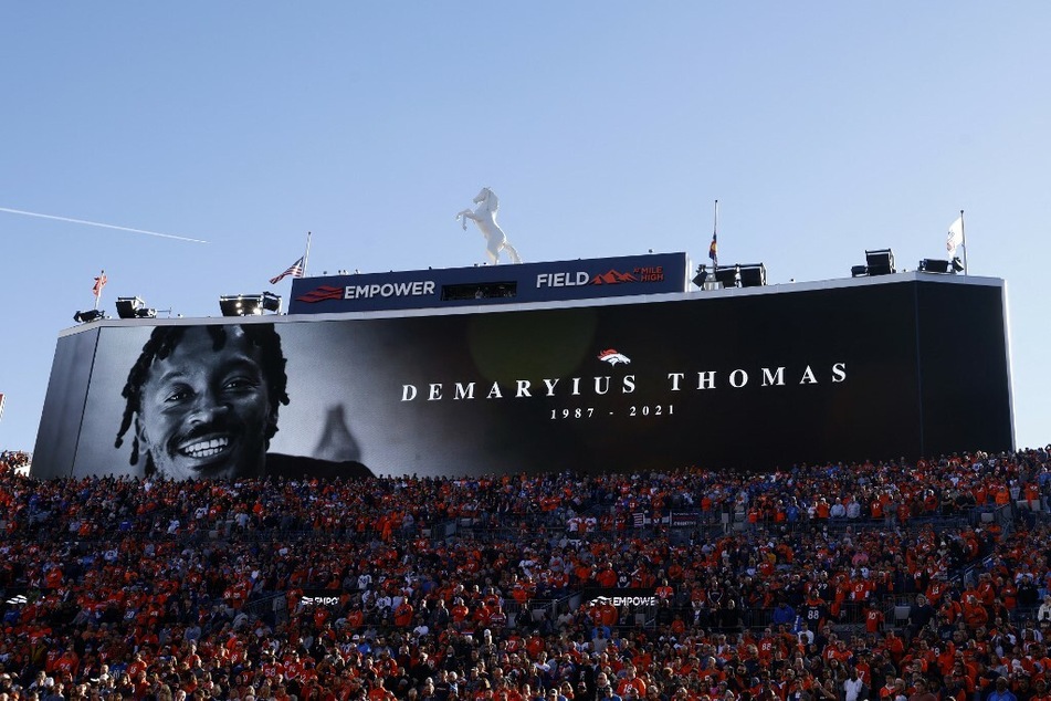 An image of the late former Denver Broncos player Demaryius Thomas is displayed on the big screen before the start of an NFL game.