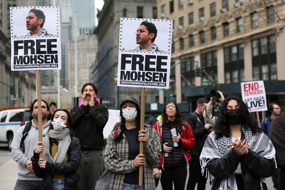 Demonstrators raise signs reading "Free Mohsen" in reference to Mohsen Mahdawi, a detained Palestinian green card holder and student at Columbia University, as they gather at Foley Square in New York City on April 15, 2025.