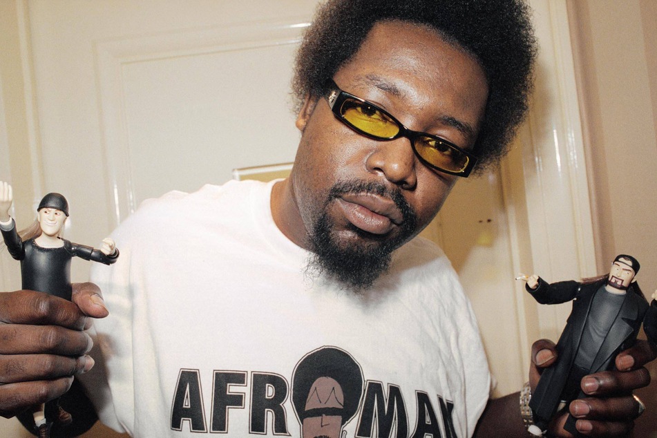 Afroman is seen holding Jay and Silent Bob figurines in 2015.