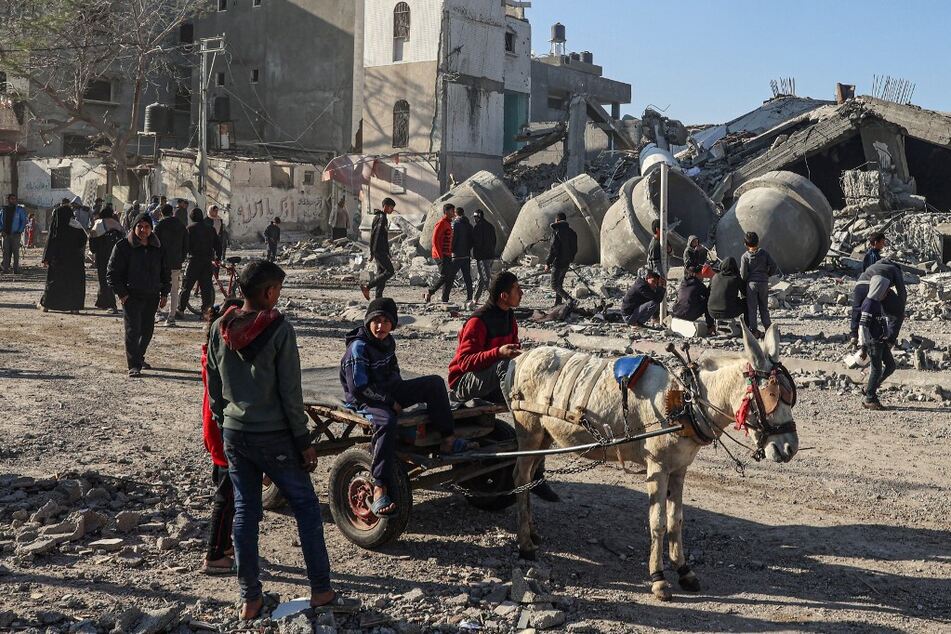Palestinians check the rubble of the al-Faruq mosque after Israeli bombardment on February 22, 2024.