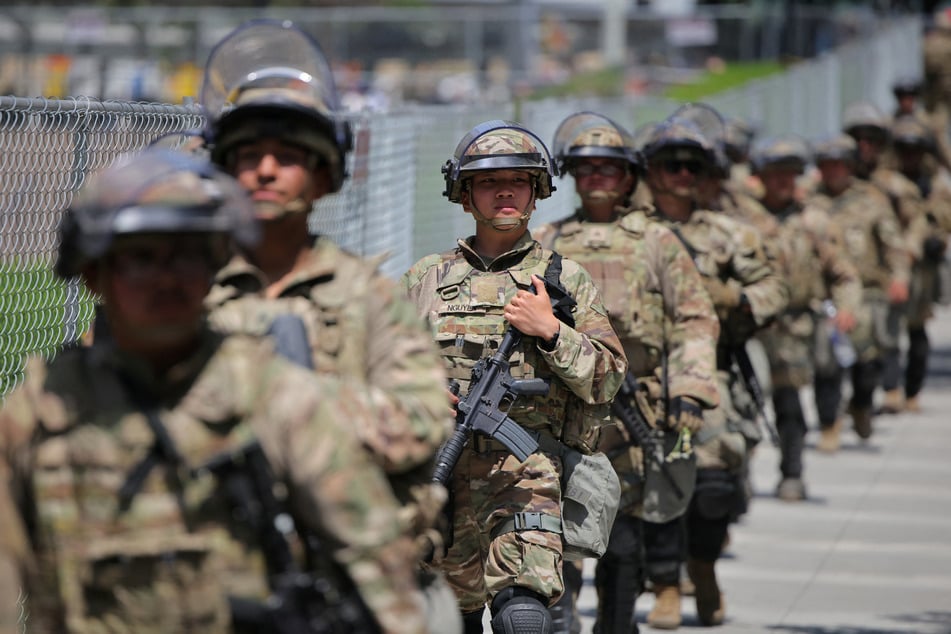 Members of the National Guard walk in formation after being deployed by Donald Trump to Los Angeles, California.