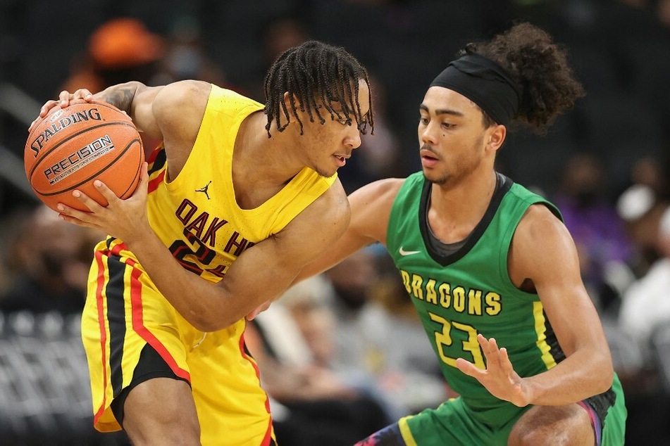 Kylan Boswell (r.) of the AZ Compass Dragons guards opponent during the Hoophall West Basketball Tournament.