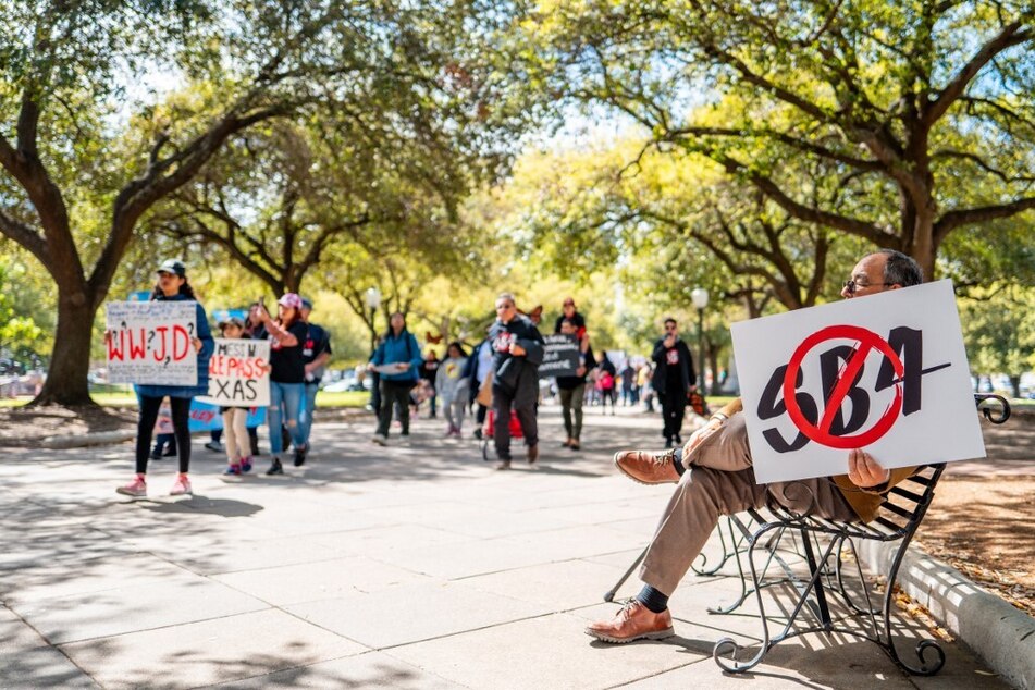 Protestors march against Texas' Senate Bill 4 outside the State Capitol in Austin on March 9, 2024.