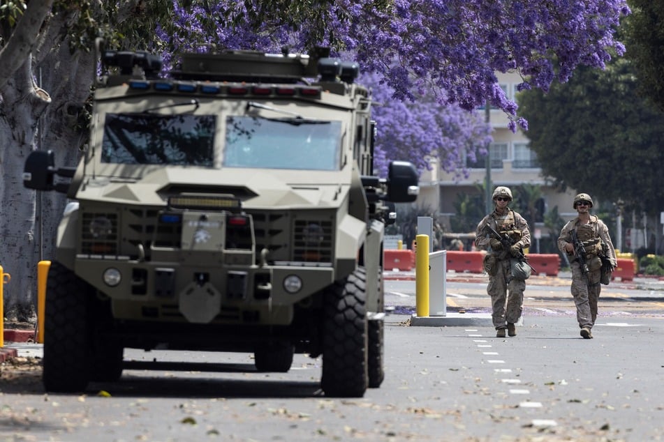 US Marines walk on the parking lot of the Wilshire Federal Building in Los Angeles, California, on Friday.