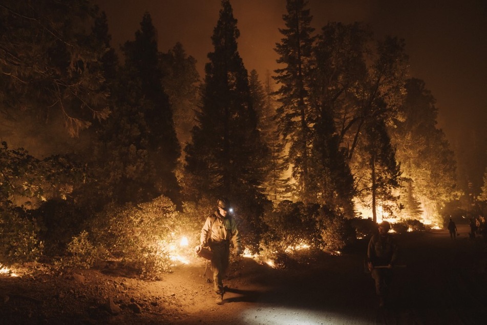 A firefighter lights a controlled burn during the Mosquito Fire on September 14, 2022, in Foresthill, California.