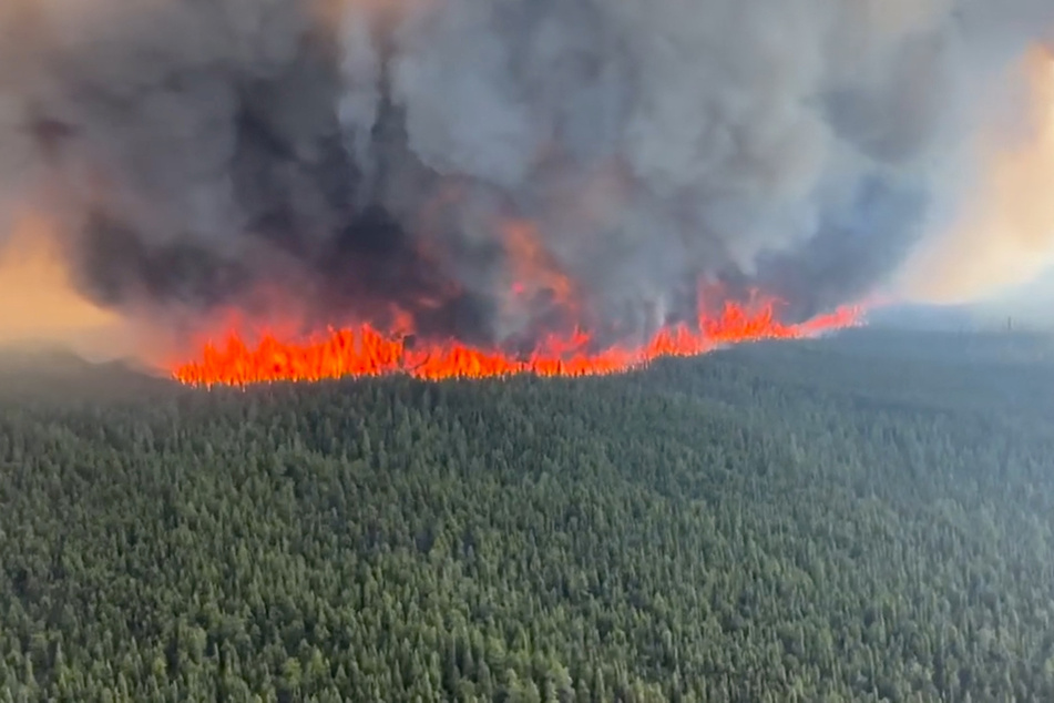 Out-of-control wildfires in British Columbia forced the evacuation of the town of Tumbler Ridge .