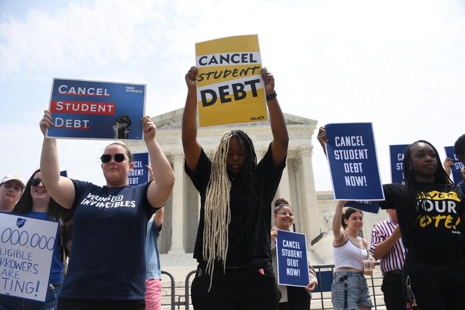 Activists and advocates for student debt cancellation rally outside the US Supreme Court.