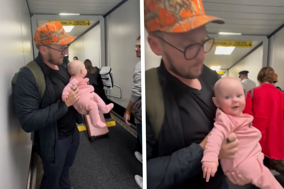 Die kleine Ava wird von ihrem Papa gehalten, während sie sich bei den anderen Passagieren "entschuldigt".