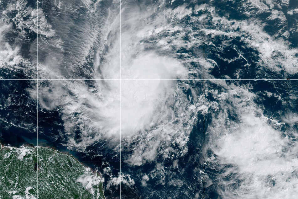 A depression in the central Atlantic has strengthened into Tropical Storm Beryl, which is expected to develop into a dangerous major hurricane as it approaches the Windward Islands Sunday night or Monday.