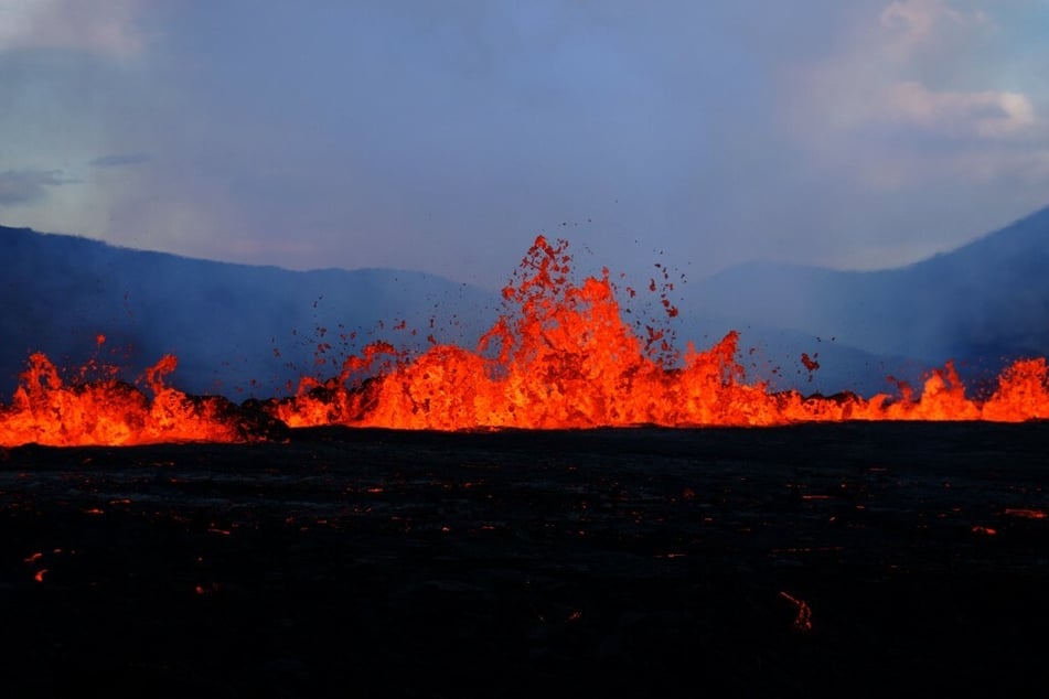 Lava spews and flows at the scene of the newly erupted volcano at Grindavik, Iceland, on August 3, 2022.