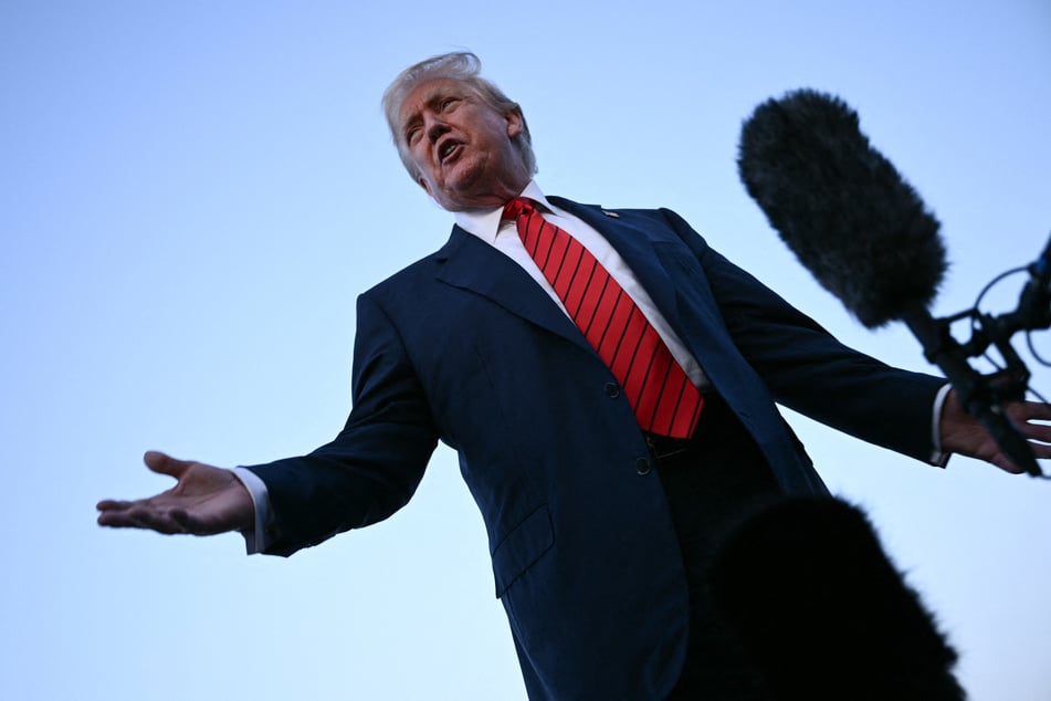 President Donald Trump speaks to journalists at Lehigh Valley International Airport in Allentown, Pennsylvania, on August 3, 2025, as returns to the White House from his Bedminster residence.