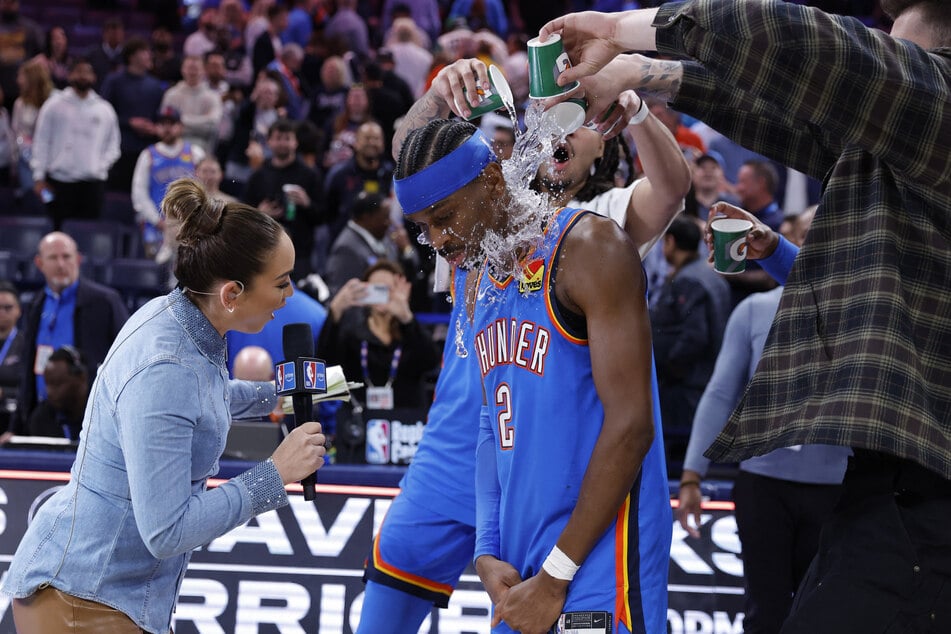 Shai Gilgeous-Alexander’s teammates pour water on him at the end of a game against the Boston Celtics on March 12, 2026.