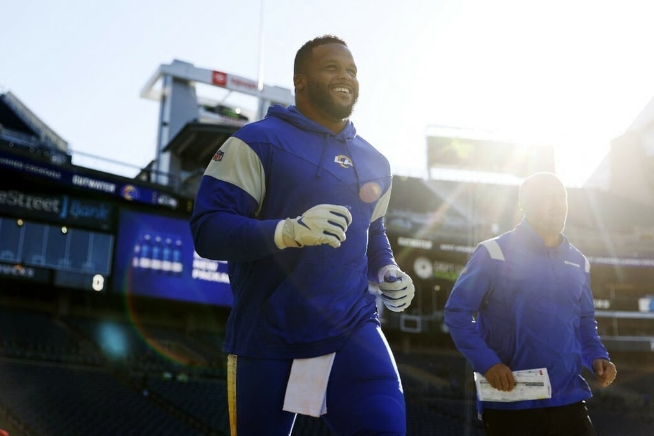 It's all smiles for three-time defensive player of the year, Aaron Donald (l.), in Luman Field.