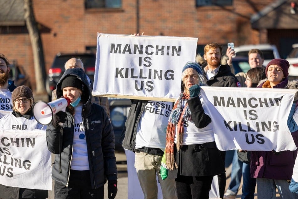 Climate Defiance activists rally outside Senator Joe Manchin's Politics &amp; Eggs event in Manchester, New Hampshire, on January 12, 2024.
