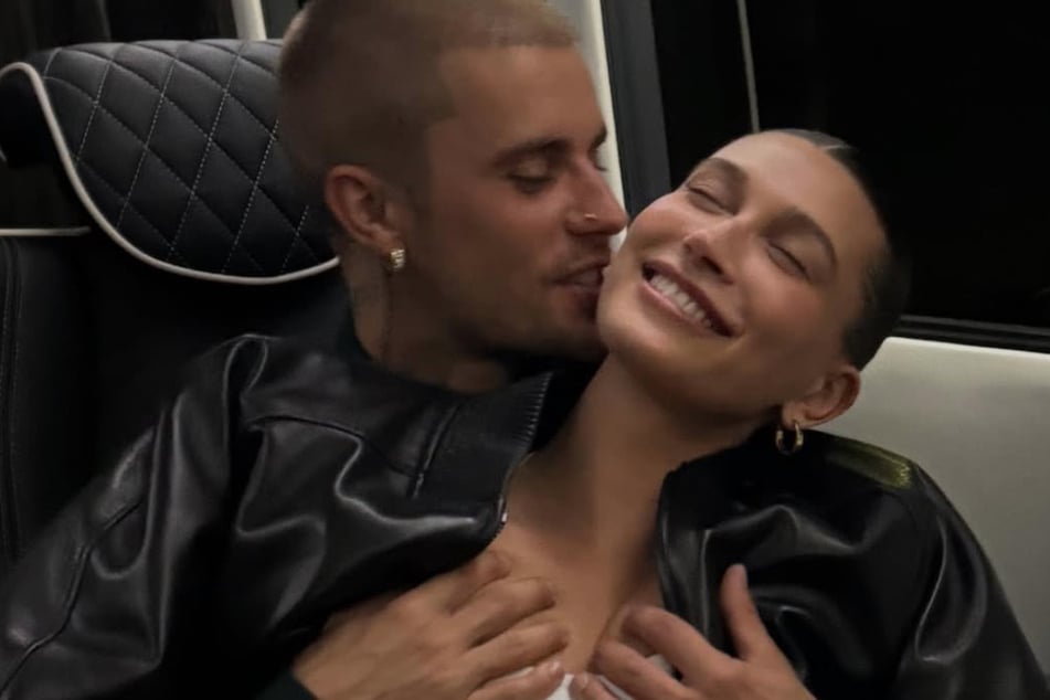Justin Bieber couldn't keep his hands off of his wife, Hailey (r.), in new images he dropped on the day of her big business deal.