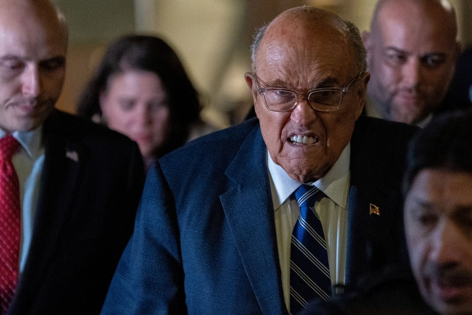 Rudy Giuliani held in contempt of court as legal woes deepen