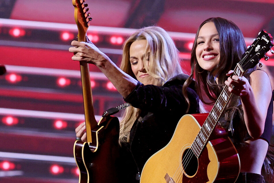 Sheryl Crow (l) has revealed the wisdom she shared with Olivia Rodrigo amid her whirlwind success in the industry.