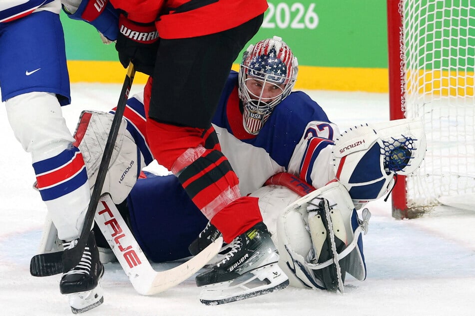 Connor Hellebuyck of Team USA makes a save during the men's ice hockey final at the Milan-Cortina Olympics on February 22, 2026.