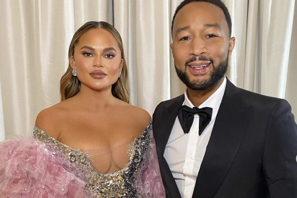 Chrissy Teigen and John Legend strike a pose before heading out to a Broadway show.