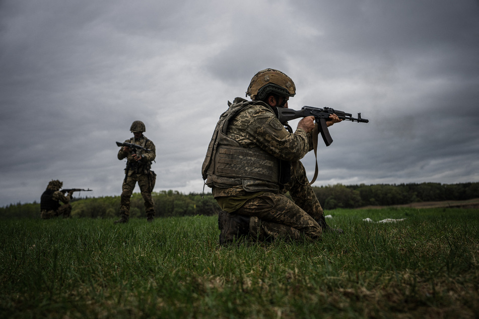 Ukrainian servicemen practice firing during a military exercise in the Kharkiv region on May 1, 2023, amid the Russian invasion of Ukraine.
