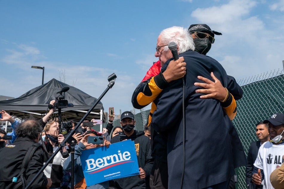 Amazon Labor Union President Christian Smalls hugs Senator Bernie Sanders during a rally at the JFK8 warehouse on Staten Island.