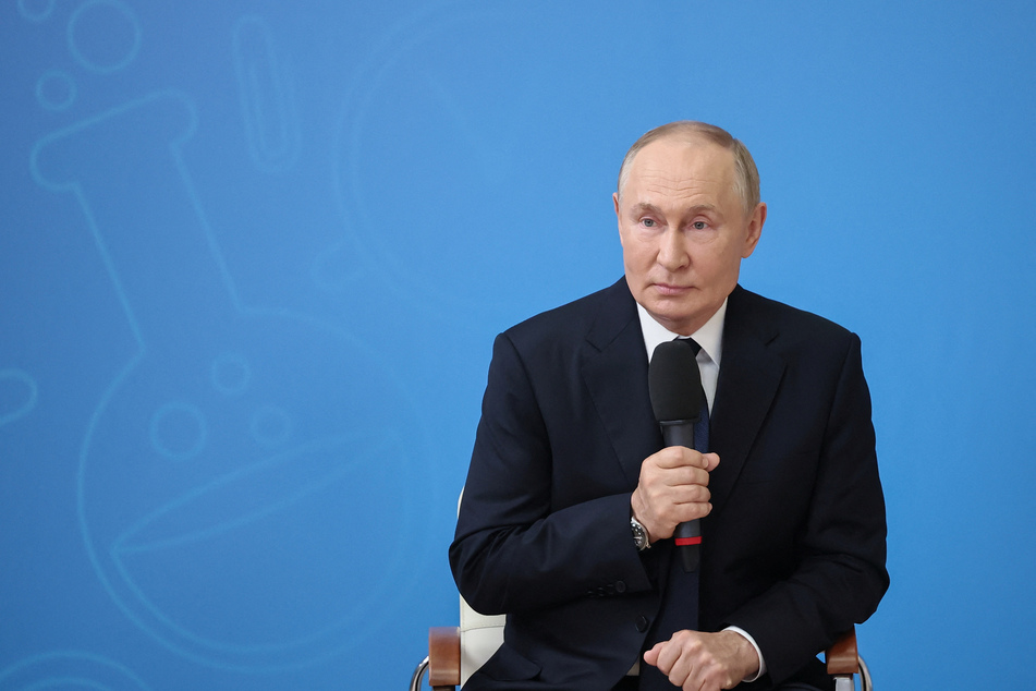 Russian President Vladimir Putin speaks with students as he visits a school to mark Knowledge Day in Kyzyl in the Republic of Tuva, Russia.