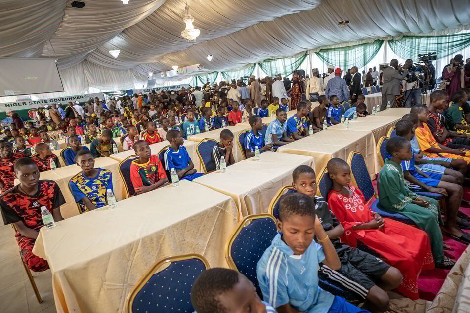 Freed school children are seen during a reception at the Governor's office in Minna on December 8, 2025.