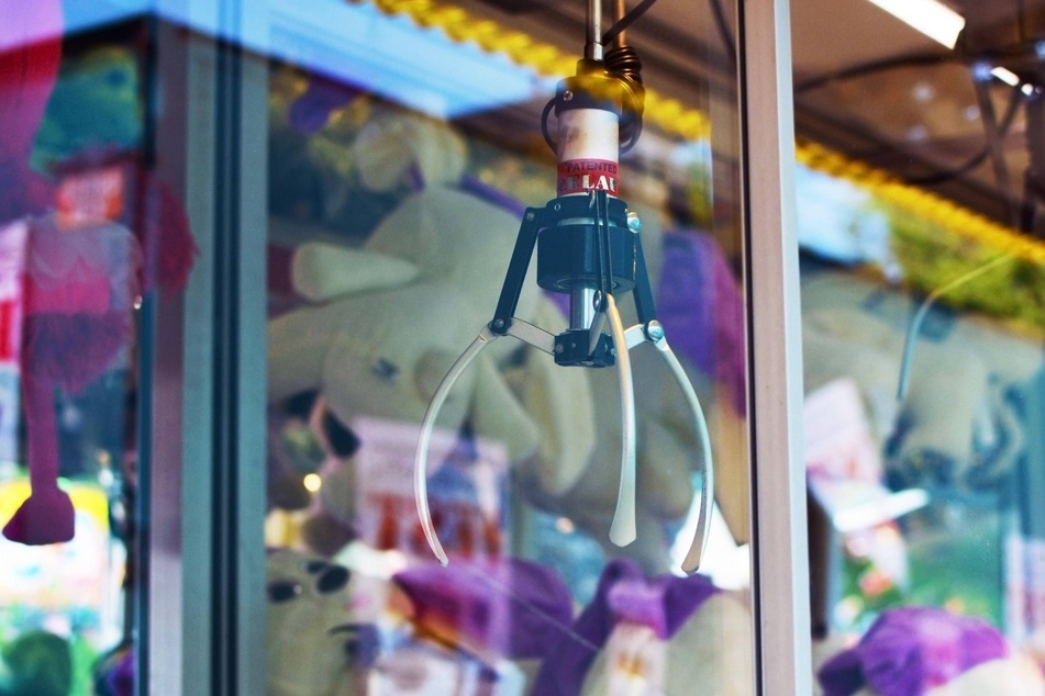 A child got stuck in a claw machine at a theme park in North Carolina and was banned for a year after it was revealed he was trying to steal a toy.
