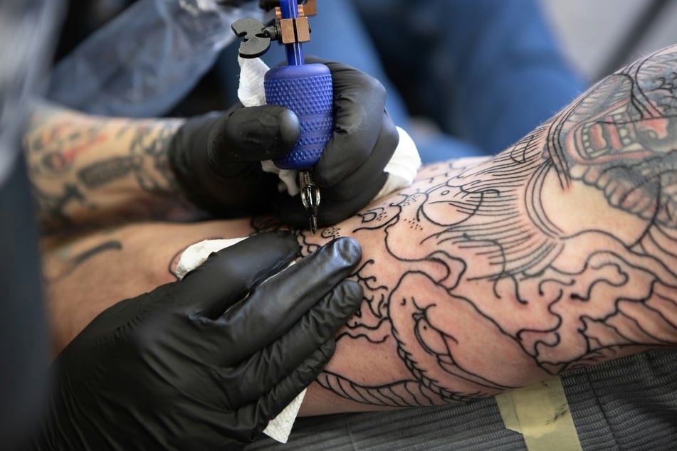 Tattoos have long been a way of memorializing dead loved ones, but now many ink fans have taken to putting cremated ashes into those tattoos (stock image).