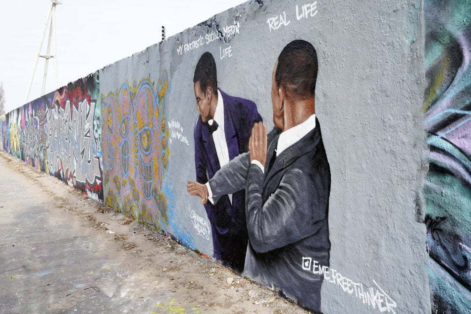 Will Smith's slap has become a global sensation and is now part of the Berlin wall.