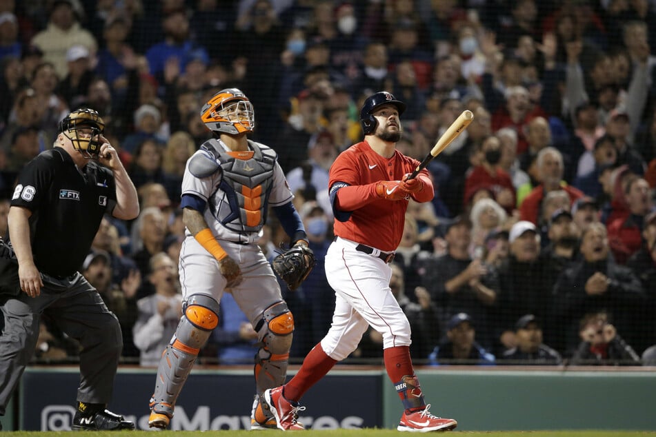 Red Sox first baseman Kyle Schwarber hits a grand slam in the 2nd inning of Boston's game three win.