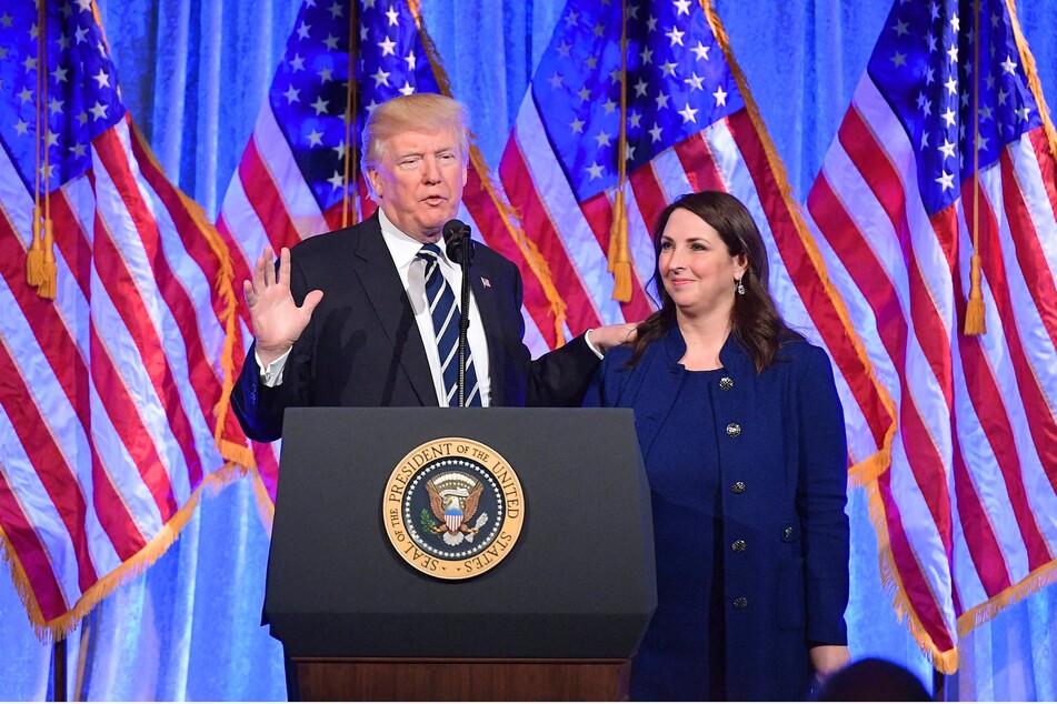 Donald Trump (l.) introducing then-RNC Chairwoman Ronna McDaniel at a fundraising event in New York City on December 2, 2017.