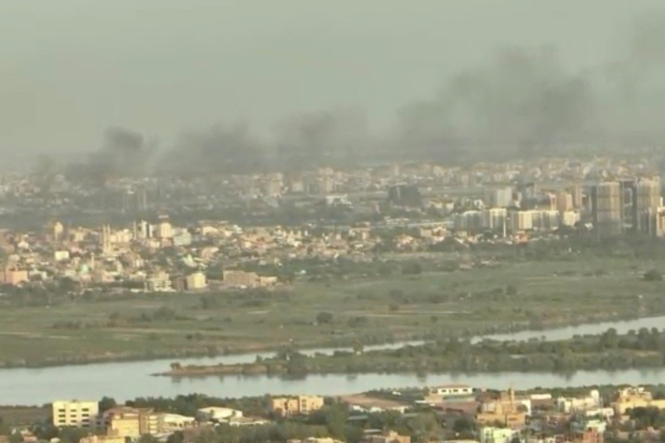 Smoke rises over buildings a week after fighting began in Khartoum, Sudan.