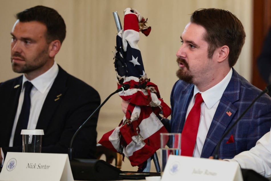 Right-wing influencer Nick Sortor brought a burned US flag as a prop to the White House roundtable.