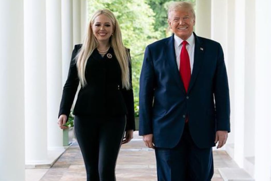 Tiffany (27) and her father Donald Trump (74) walking down a hall.