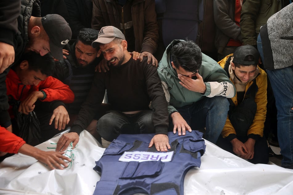 Palestinians mourn Israel's killing of five journalists in a targeted airstrike on Thursday morning.