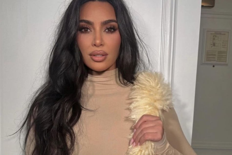 Kim Kardashian is apparently taking her kids' advice when it comes to love, but others are finding her moves "weird."